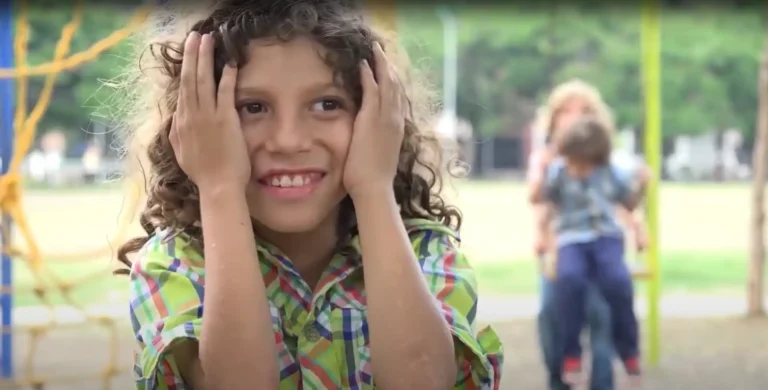Girl smiling in playground.
